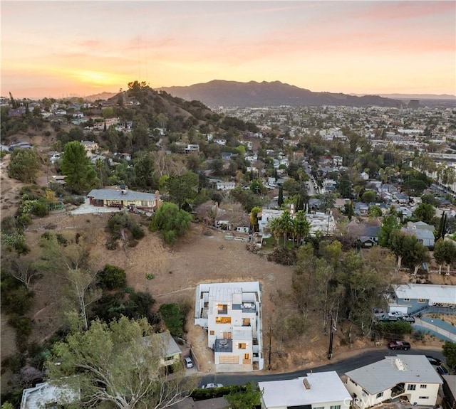 aerial view at dusk with a mountain view