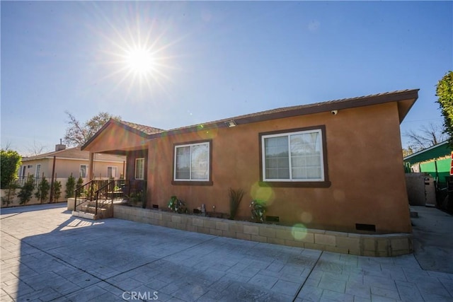 back of property featuring a patio