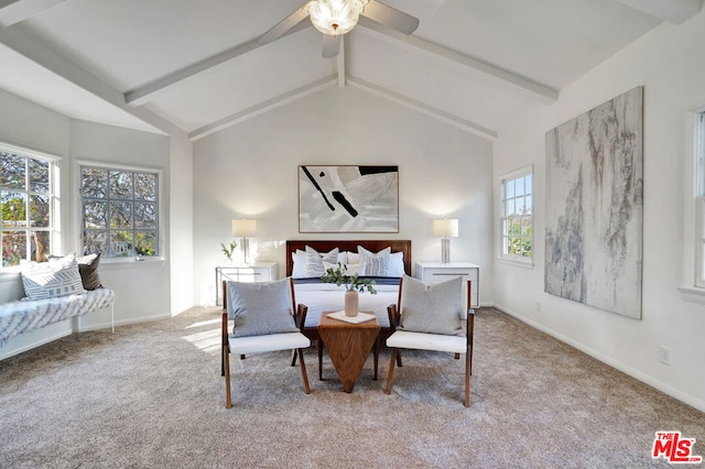 carpeted bedroom featuring multiple windows and vaulted ceiling with beams