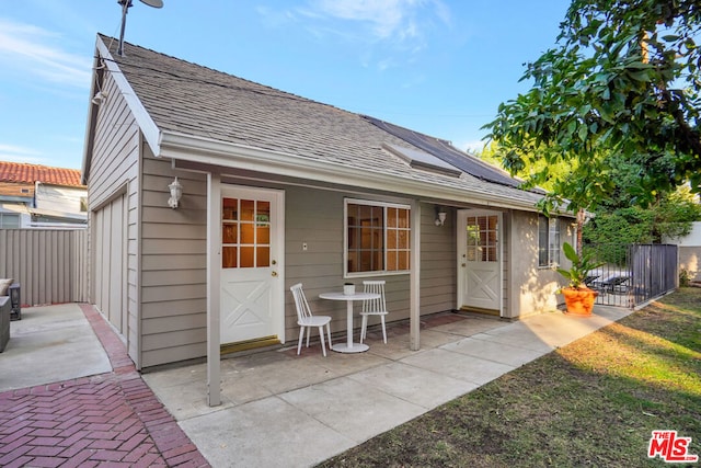 rear view of property featuring a patio