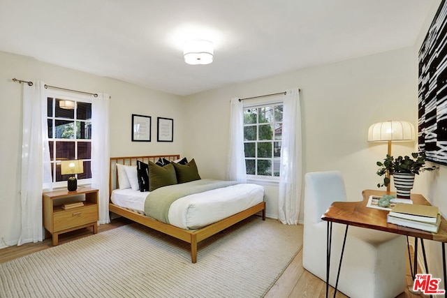 bedroom with light wood-type flooring