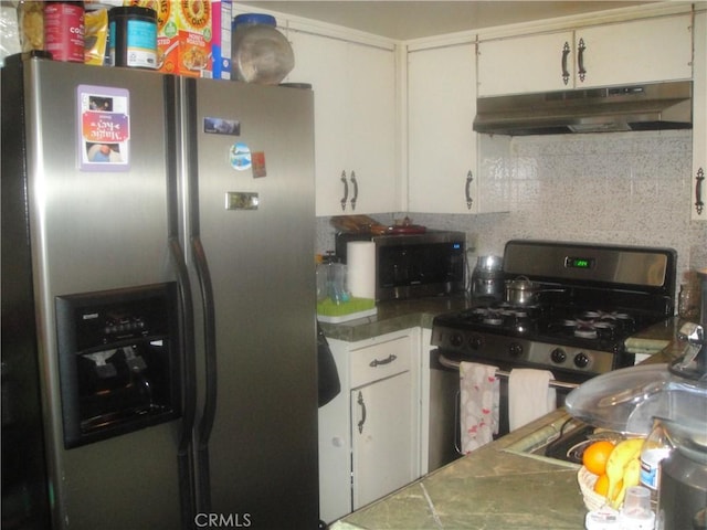 kitchen featuring tasteful backsplash, appliances with stainless steel finishes, white cabinets, and under cabinet range hood