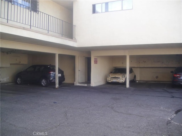 view of vehicle parking with a carport