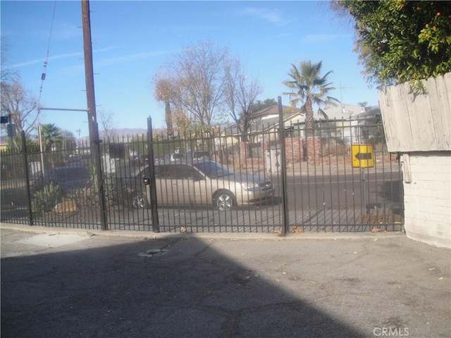 view of gate featuring fence