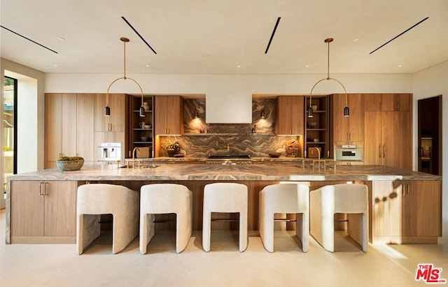 kitchen with sink, decorative backsplash, and hanging light fixtures