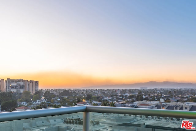 view of balcony at dusk