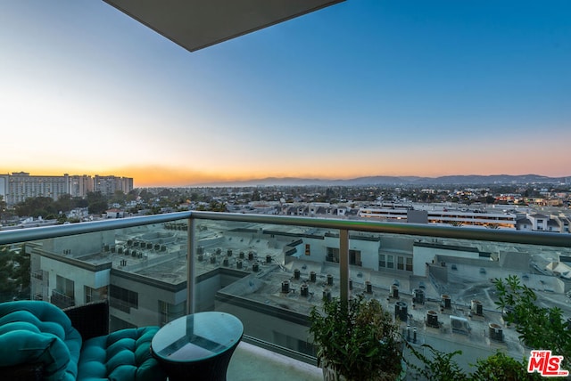 view of balcony at dusk