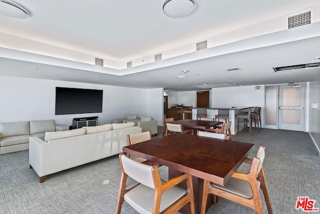 dining space with carpet floors