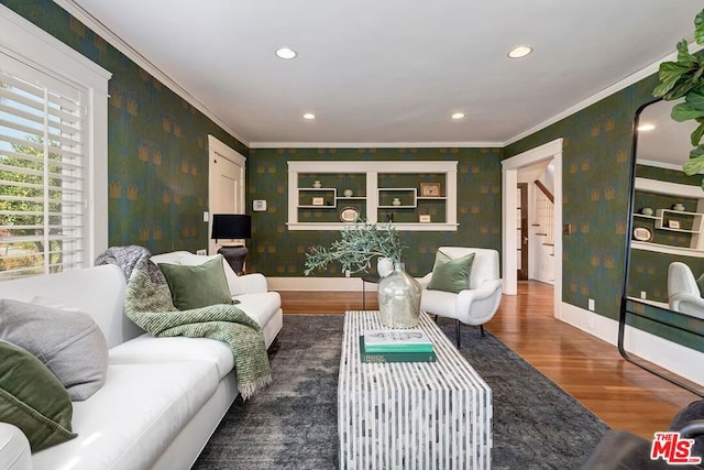 living room featuring ornamental molding and dark hardwood / wood-style flooring