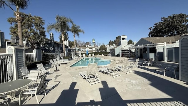 view of swimming pool featuring a patio area