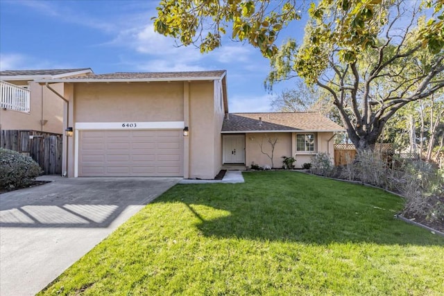 view of front of house with a garage and a front yard