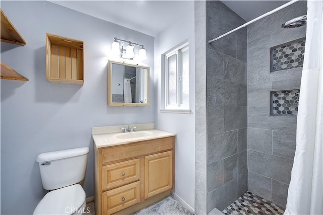 bathroom featuring walk in shower, vanity, and toilet