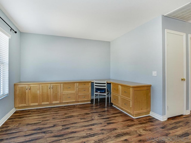 unfurnished office featuring dark wood-type flooring