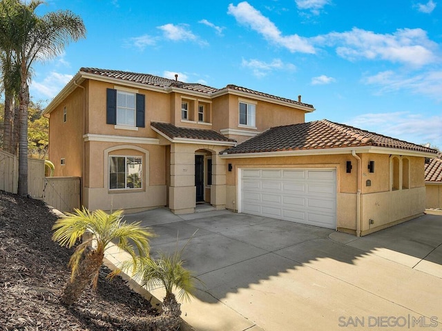 mediterranean / spanish-style house featuring a garage