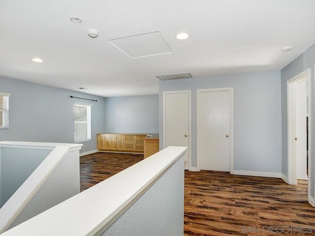 hallway with dark wood-type flooring