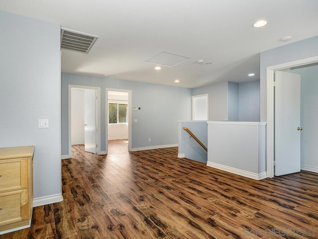 empty room with dark hardwood / wood-style flooring