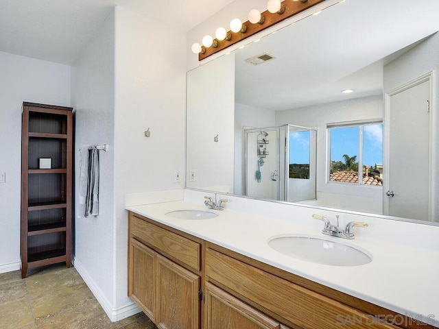 bathroom featuring vanity and walk in shower