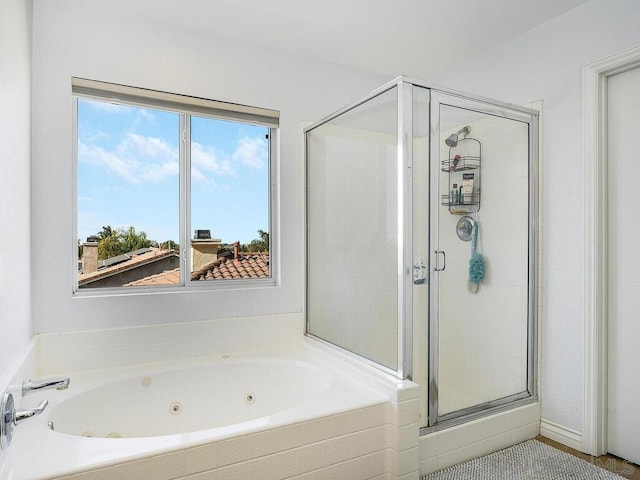 bathroom featuring plus walk in shower