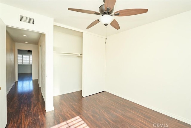 unfurnished room featuring dark wood-type flooring