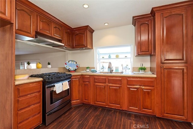 kitchen with sink, dark hardwood / wood-style floors, and gas range