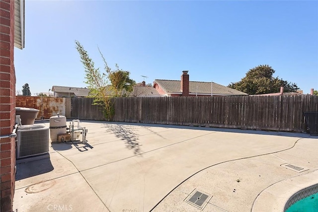 view of patio with central AC