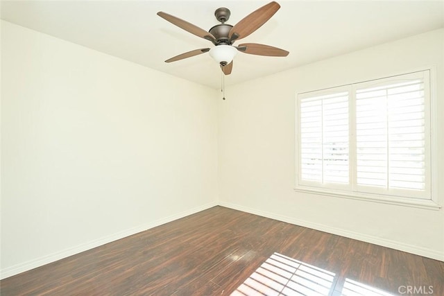 unfurnished room featuring ceiling fan and dark hardwood / wood-style flooring