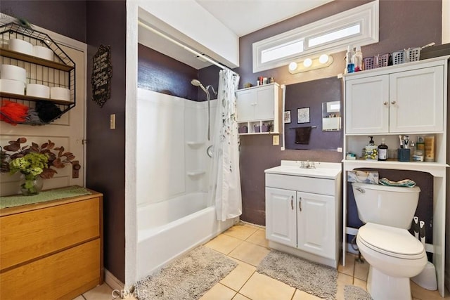 full bathroom featuring vanity, shower / bathtub combination with curtain, tile patterned floors, and toilet