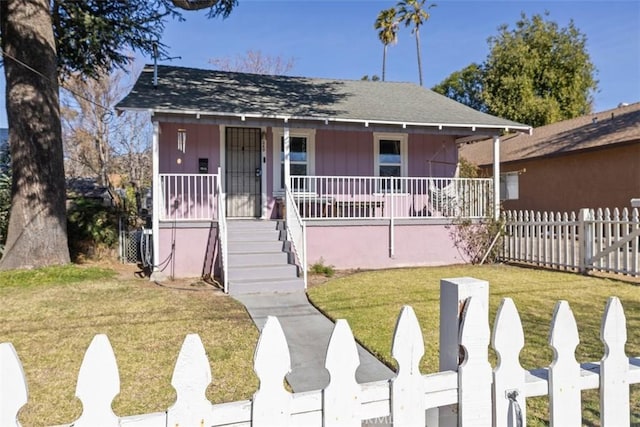 bungalow-style house featuring a front yard and covered porch