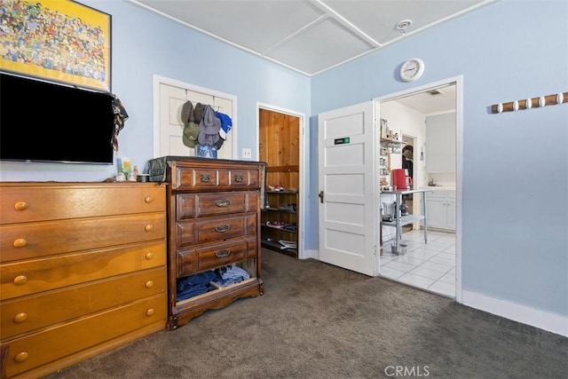 bedroom with ensuite bath and carpet flooring