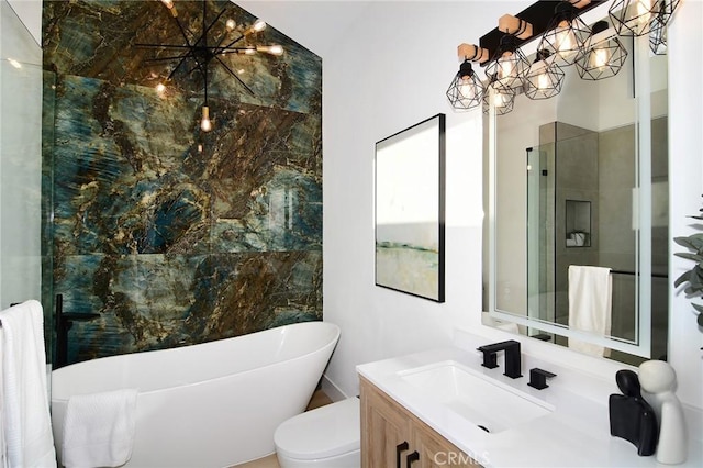 bathroom featuring a tub, toilet, vanity, and an inviting chandelier