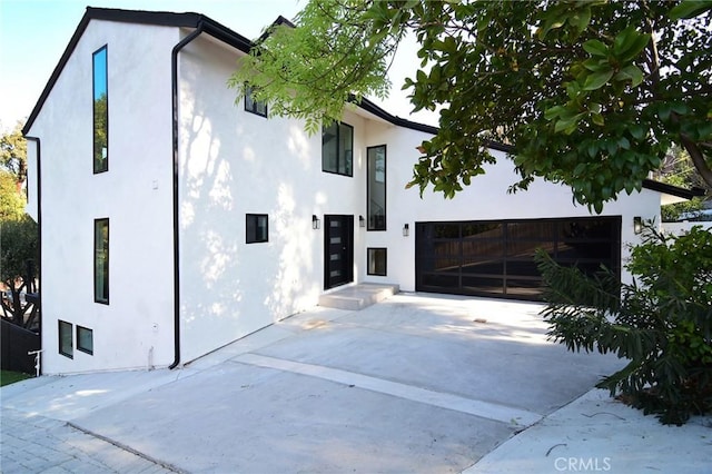 view of side of property featuring a garage