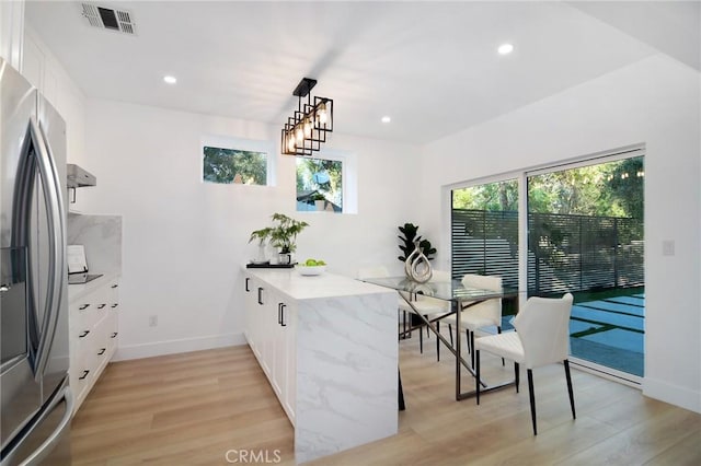 dining room with light hardwood / wood-style floors