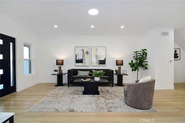 living room with light hardwood / wood-style floors