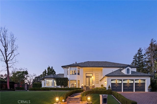 view of front of property with a lawn