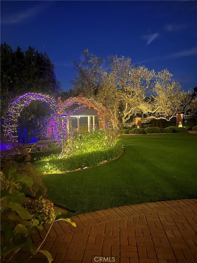 view of yard at twilight