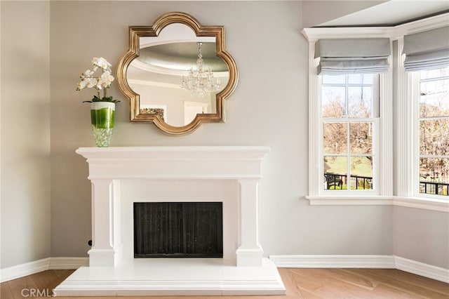 interior details featuring a chandelier and hardwood / wood-style floors