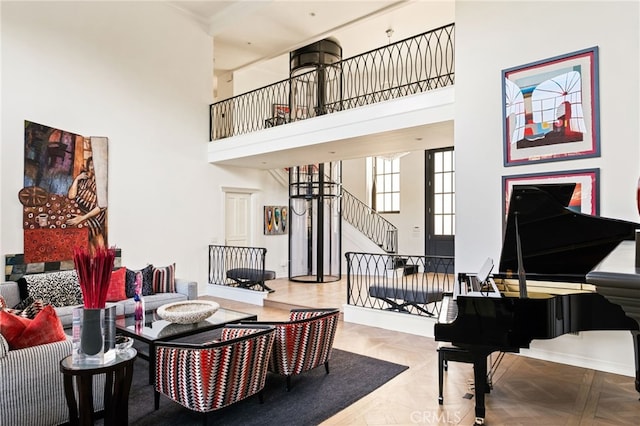 interior space with a high ceiling and parquet flooring