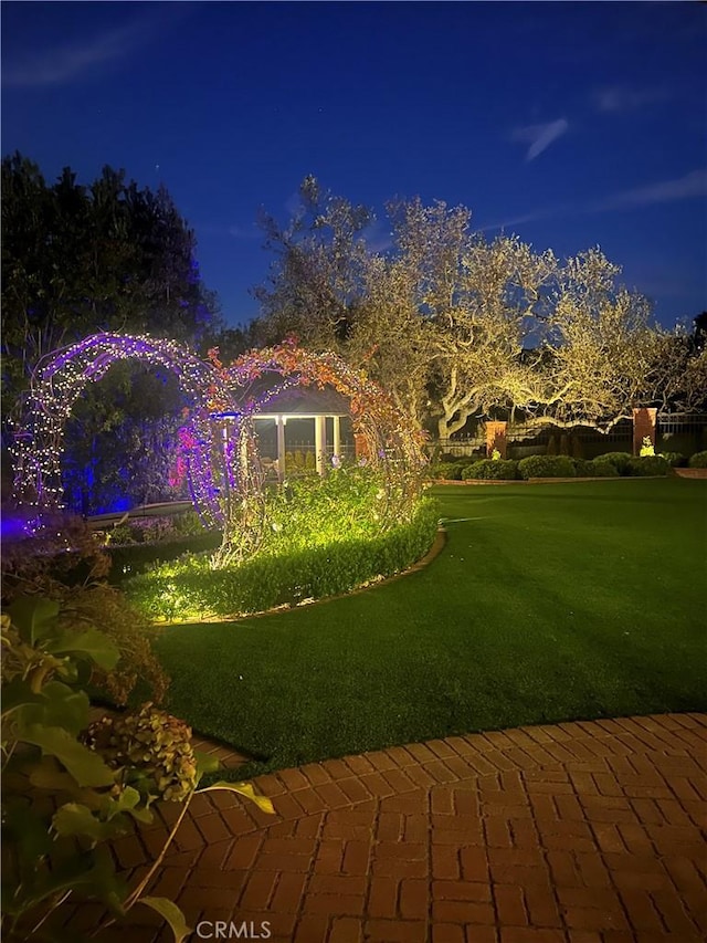 view of yard at twilight