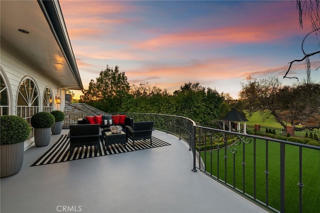view of patio featuring an outdoor living space and a balcony