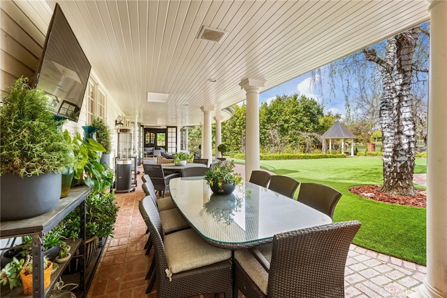 view of patio featuring a gazebo and outdoor dining area
