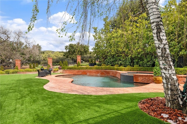 view of home's community featuring a jacuzzi, a yard, and fence