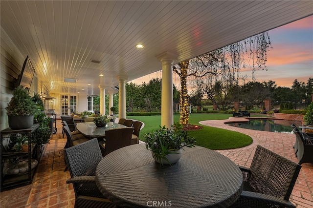 view of patio / terrace with outdoor dining space and an outdoor pool