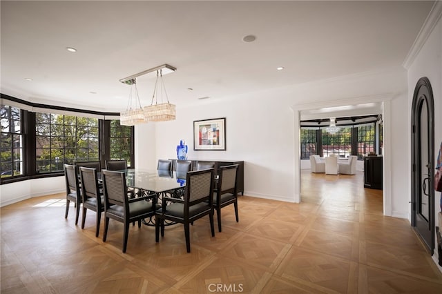dining space featuring recessed lighting, baseboards, a chandelier, and crown molding