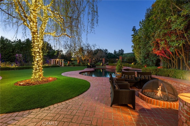pool with a playground, a patio area, a lawn, and an outdoor fire pit