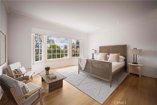 bedroom featuring recessed lighting, baseboards, wood finished floors, and crown molding