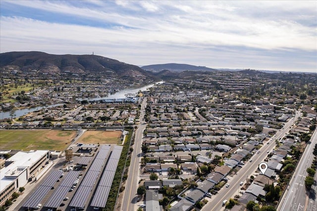 aerial view featuring a water and mountain view