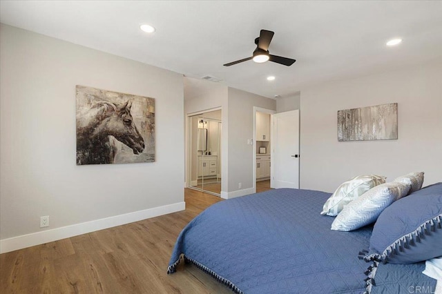 bedroom featuring visible vents, baseboards, wood finished floors, and recessed lighting