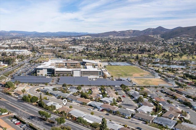 drone / aerial view featuring a residential view and a mountain view