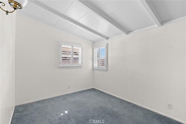 carpeted empty room with lofted ceiling with beams