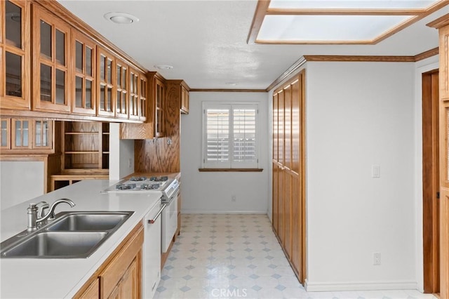 kitchen featuring sink, white gas stove, dishwasher, and ornamental molding